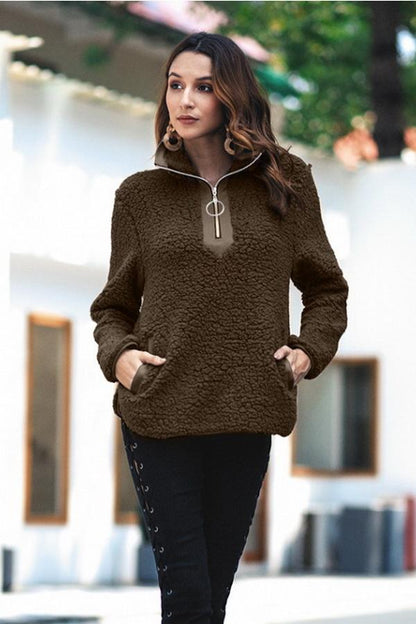 Pull pour femmes avec col rabattu et fermeture à glissière sur le devant